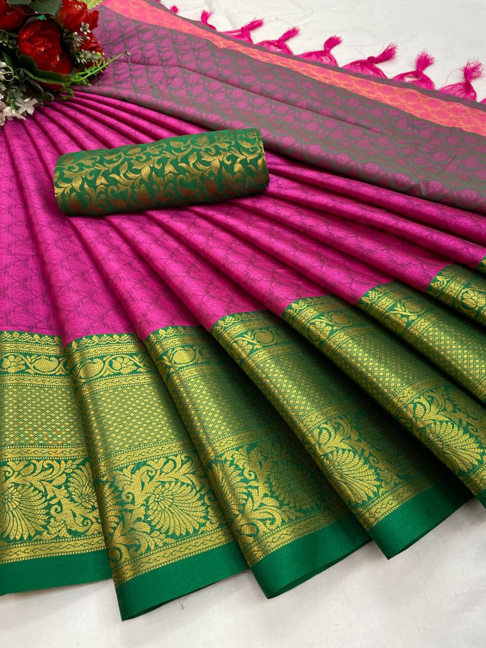 The Aura Cotton Silk saree features a broad contrast jacquard work border