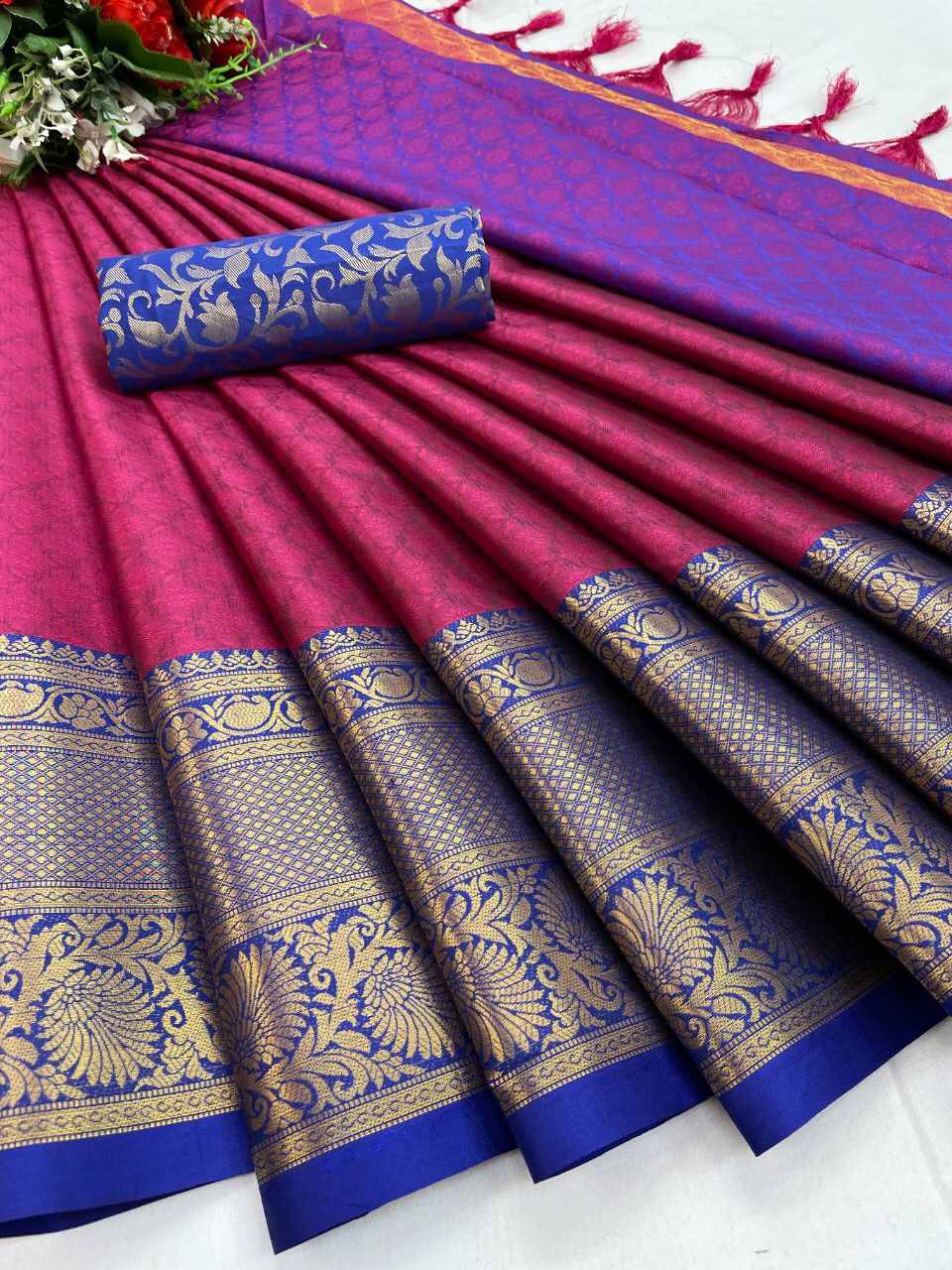 The Aura Cotton Silk saree features a broad contrast jacquard work border