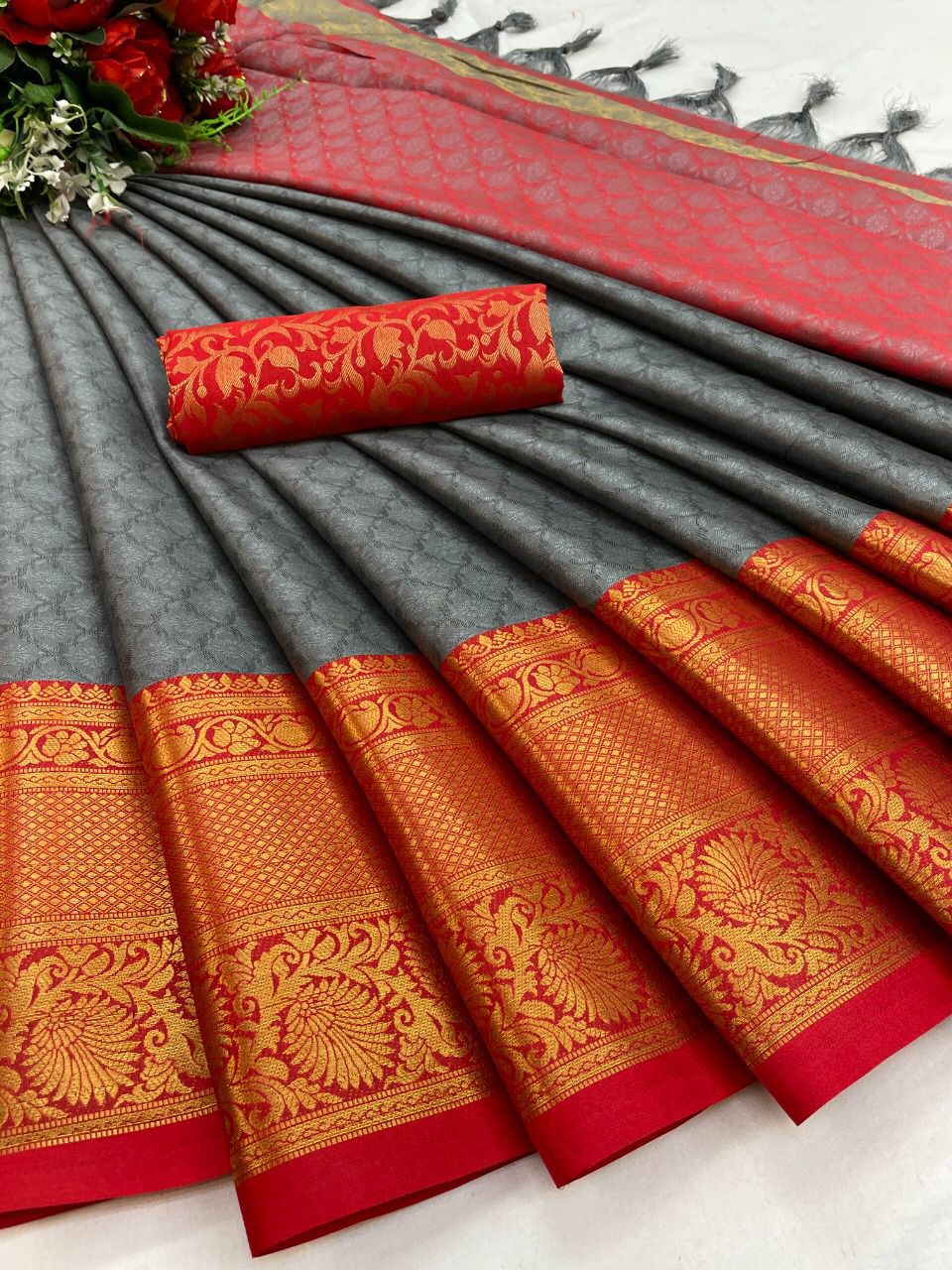 The Aura Cotton Silk saree features a broad contrast jacquard work border