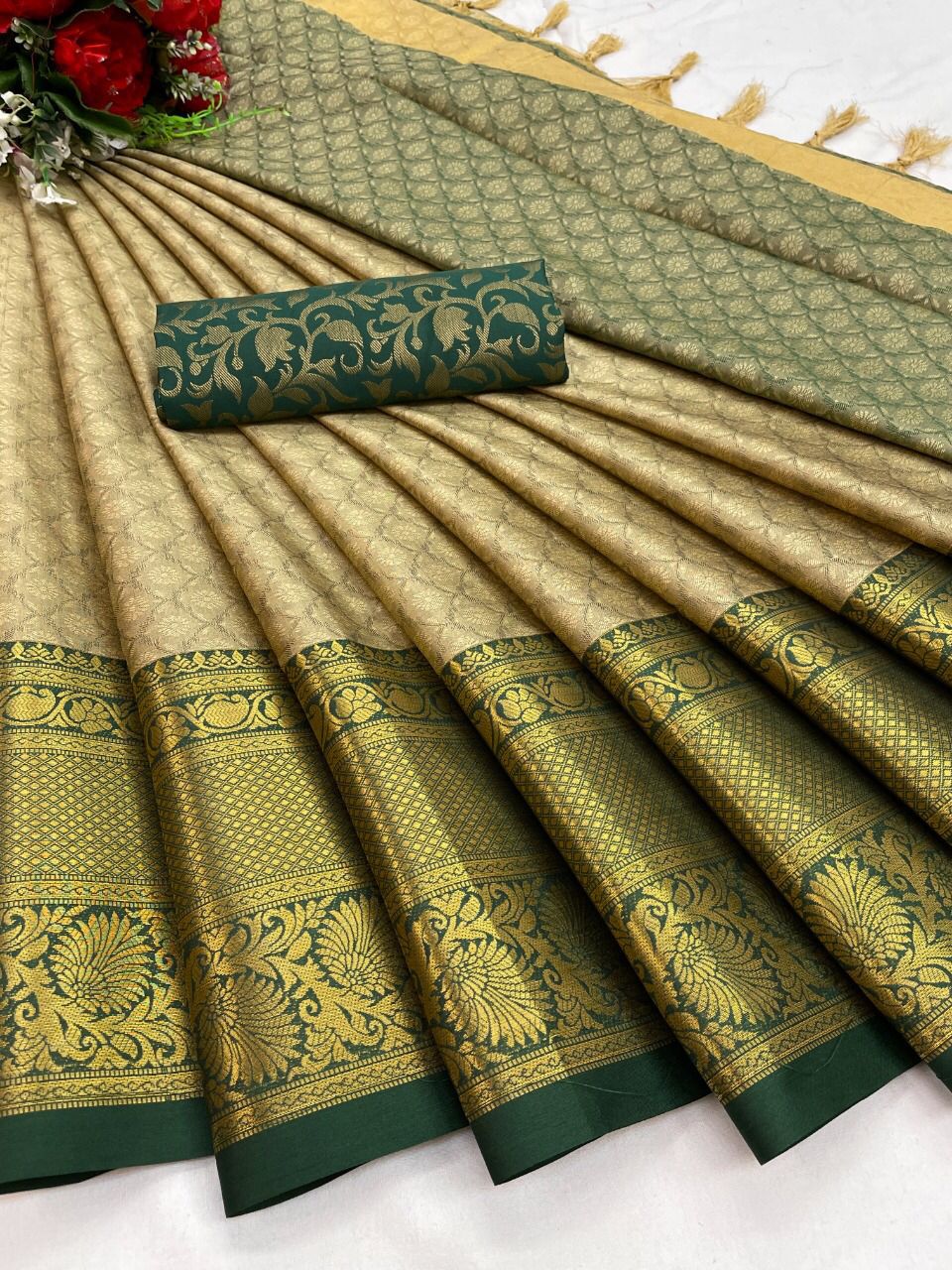 The Aura Cotton Silk saree features a broad contrast jacquard work border