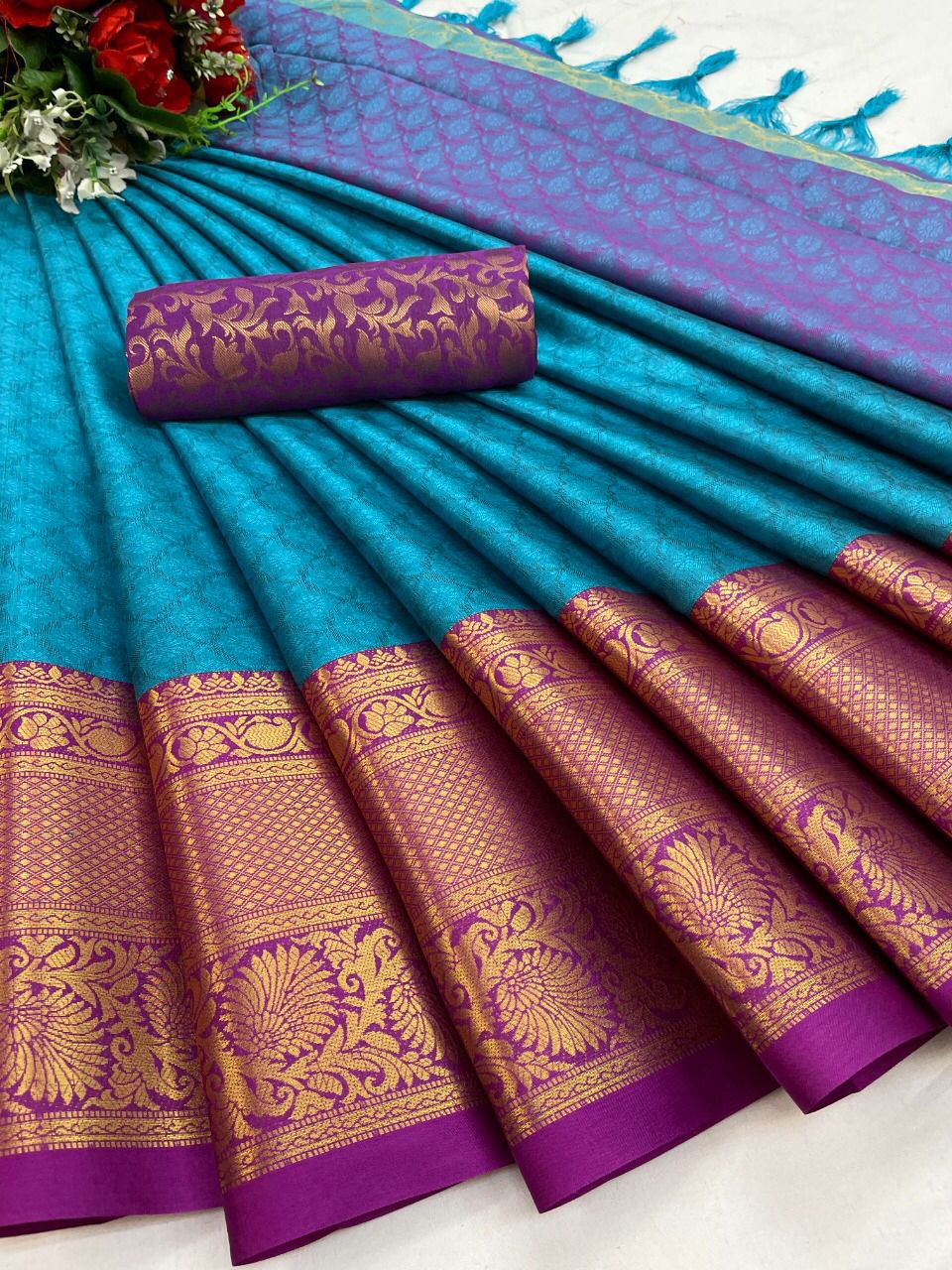 The Aura Cotton Silk saree features a broad contrast jacquard work border