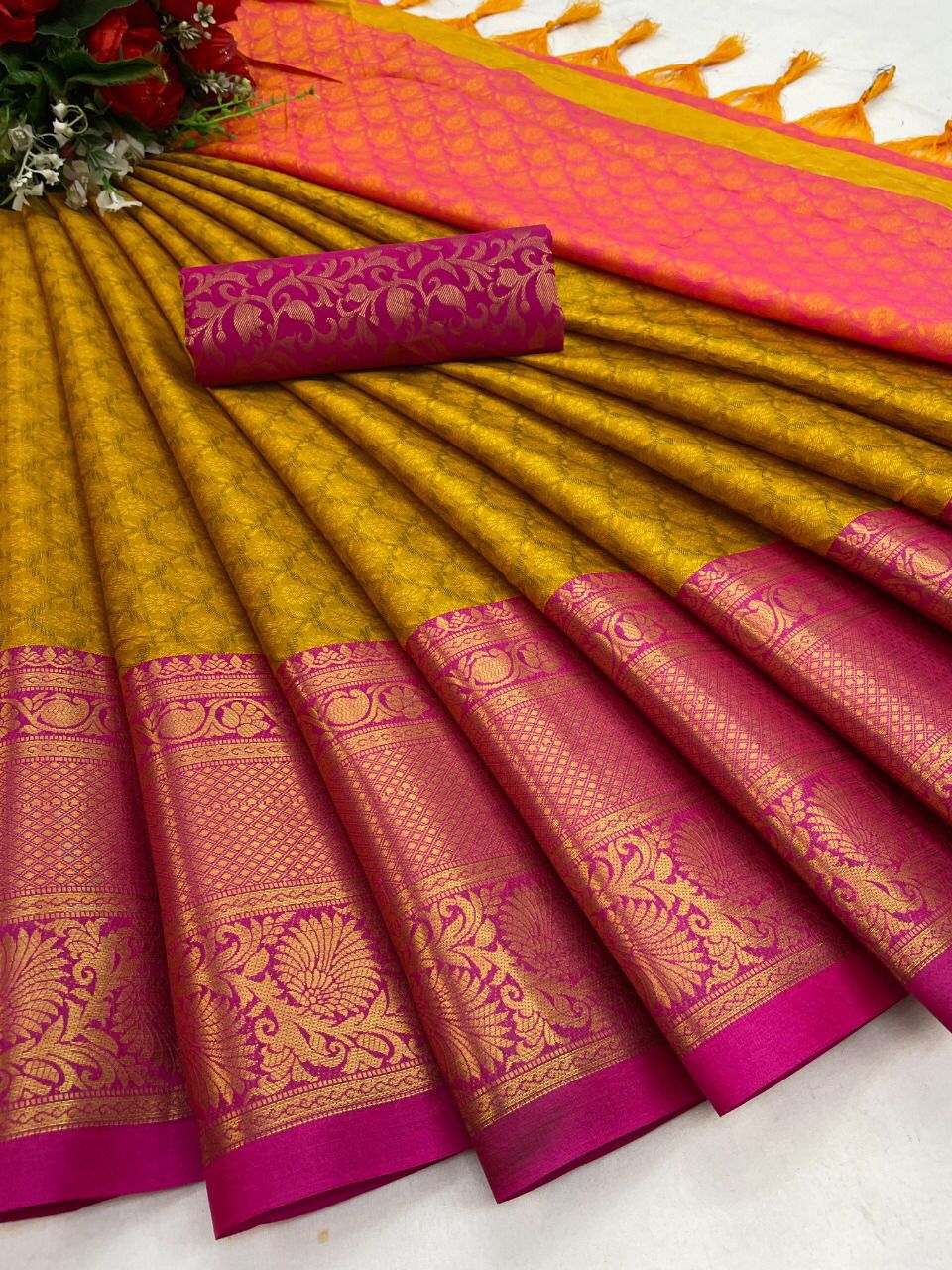 The Aura Cotton Silk saree features a broad contrast jacquard work border